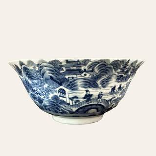 Medium-sized white-glazed ceramic bowl decorated with blue underglaze motifs