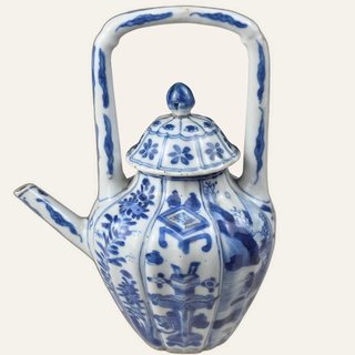 Medium-sized white-glazed ceramic ewer decorated with blue underglaze motifs